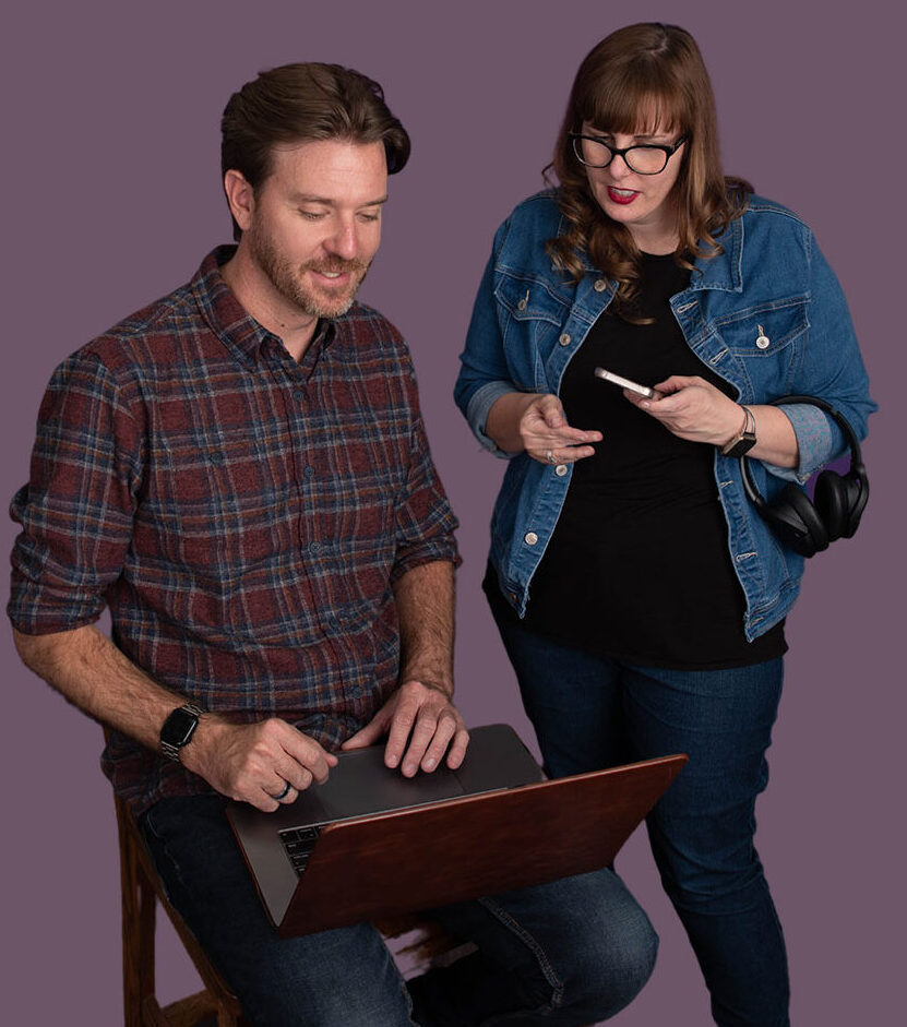 Two professionals collaborating on a project with laptop