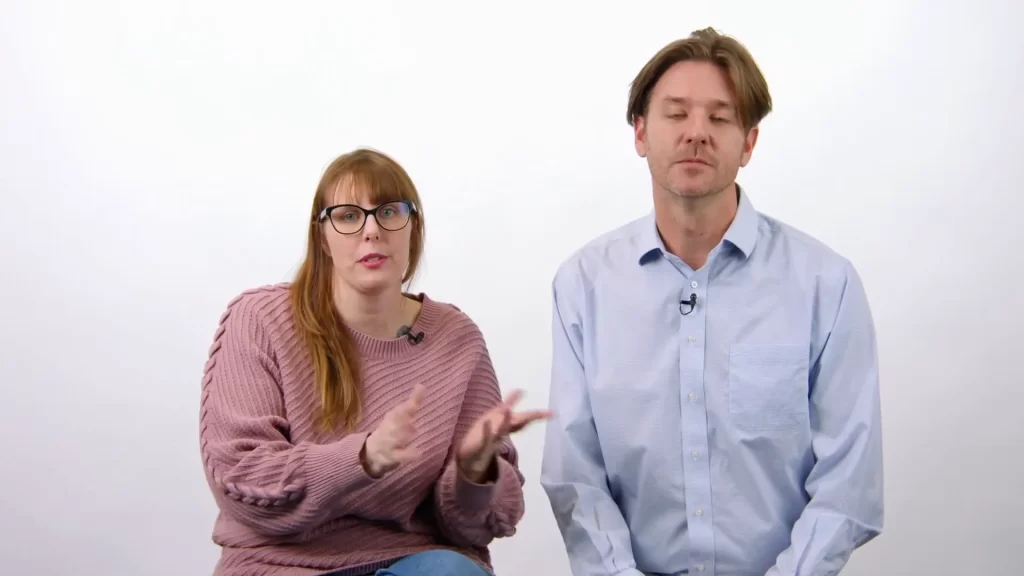 Two people sitting and having a discussion