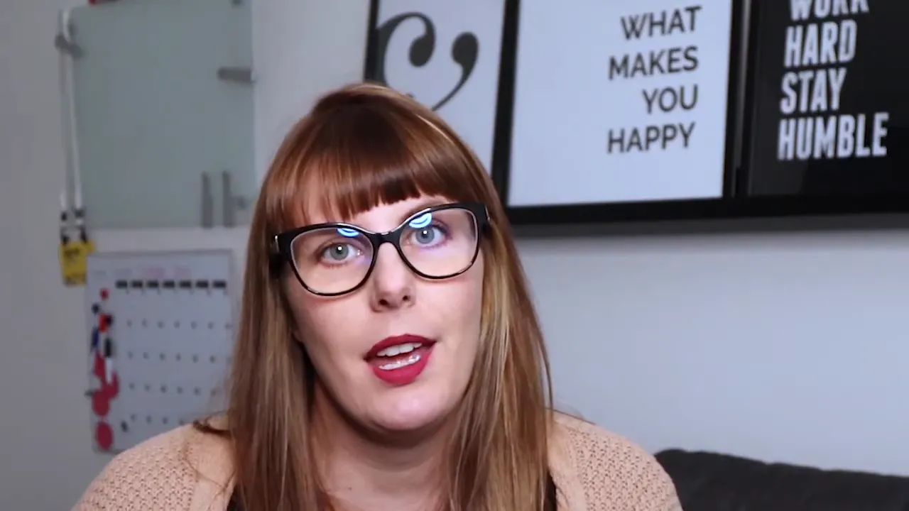 Woman with glasses speaking in home office setup