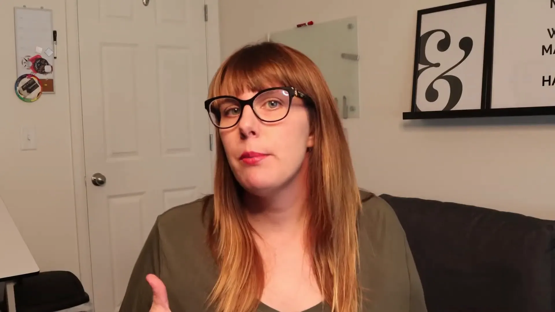 Woman with glasses speaking in a home office