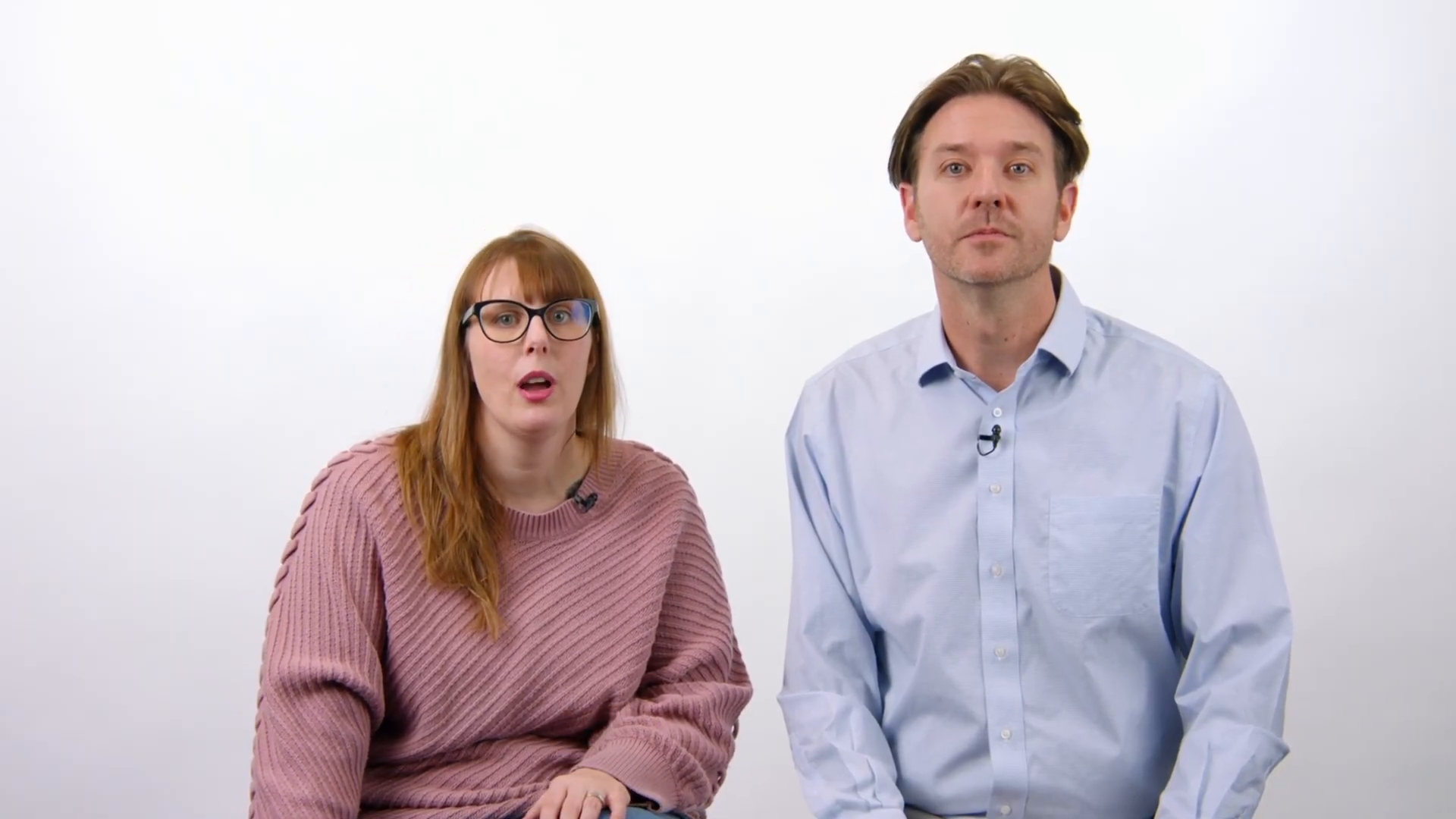 Two people posing with surprised expressions