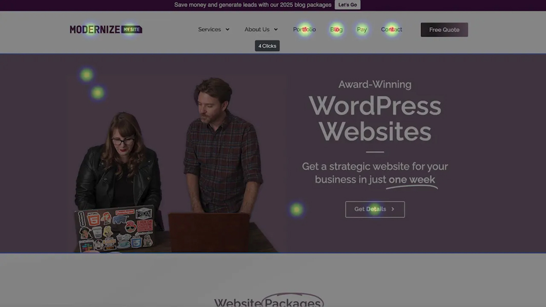 Two people stand at a desk with laptops; the website on-screen advertises award-winning WordPress websites with the headline, "Get a strategic website for your business in just one week." Colored spots reveal website engagement tracking.